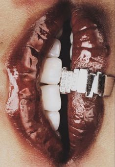 a close up of a person's mouth with chocolate on it