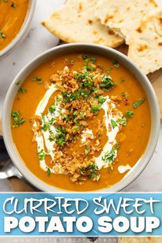 two bowls filled with carrot soup and topped with crumbled sweet potato toppings