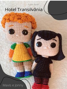 two crocheted dolls sitting next to each other