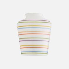 a white vase with multicolored stripes on it