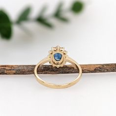 This beautiful ring features a 0.90 carat Sapphire gemstone with a halo of natural earth mined diamonds set in solid 14K gold. This Sapphire ring makes a lovely September birthstone gift for your loved ones! This ring is made with solid 14K Gold and natural Earth mined SI / G-H diamonds. As listed, this ring is ready to ship. If you're interested in purchasing this setting with a different center stone please message us! Oval Sapphire Ring With Halo Design In 14k Gold, 14k Gold Oval Halo Ring, Oval Sapphire Ring With Halo In 14k Gold, 14k Gold Halo Ring With Oval Shape, Oval Sapphire Ring With Halo Setting In 14k Gold, 14k Gold Oval Birthstone Ring With Halo Design, Oval Halo Birthstone Ring In 14k Gold, Heirloom Oval Birthstone Ring With Halo Setting, Designer Silver Jewellery