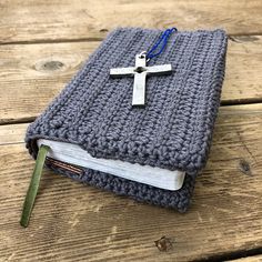 a crocheted book with a cross on it