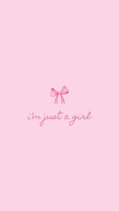 a pink wallpaper with the words in just a girl on it and a bow