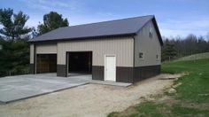 an empty garage with two doors on the side