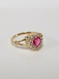 "Thanks for shopping our vintage estate store. We tend to sell well below wholesale and truly hope you enjoy all of our items. Many of the items are one of a kind, so please enjoy scrolling through the pictures and hopefully something will catch your eye. Spots are from the camera or reflections. Estate 10k yellow gold red .50ct ruby or spinel heart cz diamond ring. It's sweet. Ruby is created or synthetic, even though it's testing natural. Ring size: 8 Setting: 3/8\" 8mm Band width: 2mm Weight: Red Gold Ring, Vintage Heart Ring, Spinel Rings, Cute Promise Rings, Ruby Heart, Preppy Jewelry, Red Spinel, Gold Heart Ring, Gold Bride Jewelry