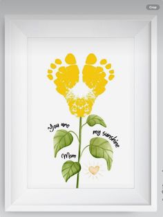 a yellow flower with the words my mom and two paw prints on it in a white frame