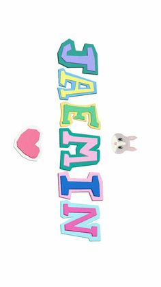 the word love spelled out in different colors and shapes next to two heart shaped pins