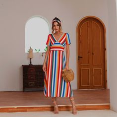 The EMES SHOP striped maxi dress is detailed with vibrant stripes that cross and cut across the dress. Features a short sleeve. v neckline. and maxi shin length. Made with 100% soft polyester that's light and breathable for casual wear at home or outside on sunny days. A great dress for beach days or vacation! MATERIAL:100% Soft Poly MEASUREMENTS: Dress Length is 42"-44"in Small | Bust: 35"-37"in & Waist: 24"-26"in Medium | Bust: 37"-39"in & Waist: 26"-28"in Large | Bust: 39"-41"in & Waist: 28"-30"in XL | Bust: 41"-43"in & Waist: 30"-32"in Summer Multicolor Midi Dress With Surplice Neckline, Striped V-neck Maxi Dress For Spring, Multicolor Maxi V-neck Dress For Summer, Striped V-neck Maxi Dress For Vacation, Multicolor Maxi Dress With Surplice Neckline For Summer, Multicolor Maxi Length V-neck Dress For Summer, Multicolor Surplice Neckline Maxi Dress For Summer, Striped V-neck Midi Dress For Beach, Beach Dresses With Vertical Stripes And V-neck