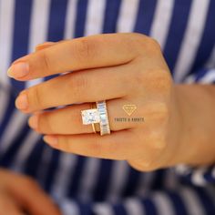 a woman's hand with a diamond ring on her left hand and the word perfect & smart written in gold