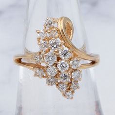 a close up of a ring on a clear glass display case with snowflakes in the background