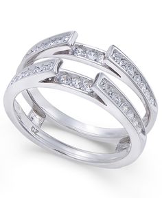 a white gold ring set with diamonds on the sides and two rows of channeled bands