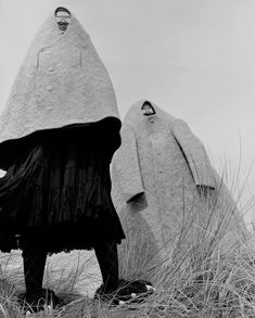 black and white photograph of two sculptures in the grass