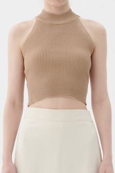 Finley Knitted Crop Top Halter neck style, racer back Cropped length, slim fit Product Specification : 50% Rayon 45% Acrylic 5% Span Professional Clean Only / Do Not Tumble Dry Model's height is 5′ 6″ (170cm) Bust 31.5in Waist 23in Hip 34.5in and wearing S/M Beige Stretch Knit Crop Top, Fitted Beige Knit Tank Top, Sleeveless Knit Stretch Halter Top, Stretch Knit Sleeveless Halter Top, Sleeveless Stretch Knit Halter Top, Fitted Knit Crop Top In Beige, Fitted Knit Beige Crop Top, Summer High Neck Knit Top, Beige Fitted Halter Neck Tank Top