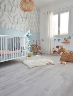 a baby's room is decorated in pastel colors