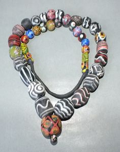 This necklace with different colorful handmade glass beads originates from Thailand. The hanging length of the strand is 36 cm. The diameter of the beads is 0.9 cm to 2.5 cm. Its weight is 190 gram. (e13) SHIPPING SHIPMENT is FREE. All items are shipped within two working days after receipt of payment. We send everything by registered airmail. Insured packets (over 50 cm length / over 1500 gram) I send by standard way. PAYMENT Paypal is preferred. RETURN POLICY: NO RISK: Any item may be sent bac Handmade Multicolor Pendant Beads, Unique Multicolor Long Beaded Necklace, Multicolor Czech Glass Oval Bead Necklace, Multicolor Czech Glass Necklace With Oval Beads, Multicolor Czech Glass Necklaces With Oval Beads, Multicolor Beaded Necklace With Pendant, Handmade Oval Glass Beads, Handmade Multicolor Glass Necklaces, Artisan Multicolor Single Strand Necklace