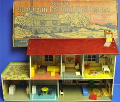 a doll house with furniture and accessories in front of a metal sign that says suburban colonial doll house