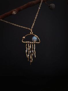 ♥♥♥♥♥ FREE SHIPPING WORLDWIDE when purchasing 2 or more items!!!♥♥♥♥♥  US FREE SHIPPING for orders over $35♥ A B O U T - T H I S -  D E S I G N :This jellyfish pendant is so unique and fun. A natural labradorite bead ( 9-10mm) is featured to give a hint of blue tones to the overall look. clear mini glass beads are threaded on to the "tentacles " to represent water droplets. these waved tentacles are also moveable. The chain is gold plated and available in 4 lengths: 16", 18", 20" and 22". All ne Artsy Dangle Jewelry For Gifts, Artsy Gold Pendant Jewelry, Artsy Wire Wrapped Jewelry For Gifts, Artsy Wire Wrapped Jewelry Gift, Artsy Brass Jewelry For Gifts, Jellyfish Jewelry, Jellyfish Necklace, Jellyfish Pendant, Copper Wire Art