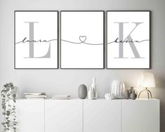 two posters with the letters k and l on them, one has a heart in it