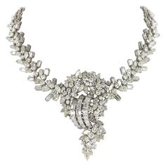 Impressive diamond necklace in 18 karat white gold. Designed as a node with swag elements. Prong set with 231 brilliant-cut diamonds totalling approximate 18.20 ct. Further set with 141 fancy-cut diamonds (emerald-cuts, pear-shapes and marquise-cuts) totalling approximate 32.00 ct. The necklace carries a total of 372 diamonds totalling 50.2 ct. The average quality of the diamonds is G to I Color and vs clarity. This necklace definitely makes some noise! Length: 43.0 cm / 16.92 inches Maker's mar Pear Shaped Diamond Necklace, Dripping In Diamonds, Iconic Jewelry, Goth Wardrobe, V Design, The Bling Ring, Queen Style, Flawless Diamond, Rings Luxury