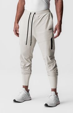 Lightweight, stretchy and ready to conquer the elements, these water-repellent joggers sport a higher waist and tall, stay-put ribbing circling the ankles. 28 1/2" inseam; 7 1/2" leg opening; 12 1/2" front rise; 16 1/2" back rise (size Medium) Elastic/drawstring waist Front slant pockets; back welt pocket Tetra-Lite fabric offers lots of stretch plus durable water-repellent (DWR) protection against the elements. 78% nylon, 22% spandex Machine wash, line dry Imported Sporty Jogging Bottoms With Functional Drawstring, Stretch Athleisure Joggers With Functional Drawstring, Athleisure Joggers With Stretch And Functional Drawstring, Stretch Sweatpants With Functional Drawstring For Sports, Sporty Moisture-wicking Micro-elastic Pants, Sporty Micro-elastic Moisture-wicking Pants, Nylon Athleisure Pants With Functional Drawstring, Athleisure Activewear With Functional Drawstring For Jogging, Sporty Activewear With Functional Drawstring For Jogging