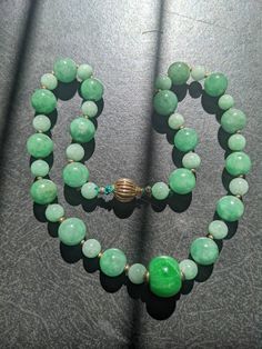 All the green beads are of natural genuine jadeite, some has stone lines, but it doesn't affect its beauty and quality. Length of the necklace:45.7cm The biggest Center bead is 1.6cm x 1.3cm The middle size beads are 1.1cm dm each The smallest ones are 0.8cm dm each. This is a rare to find necklace. Luxury Jade Beaded Necklace With Gemstone Beads, Celtic Jewellery, Cat Hug, Bead Necklaces, Turquoise Ring Silver, Turquoise Bracelet Cuff, Green Beads, Jade Necklace, Flower Pendant Necklace