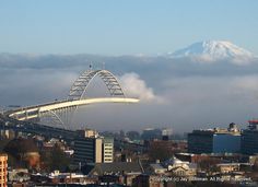 a view of a city with mountains in the background