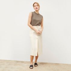 This midi-length skirt is made from a Turkish two-way stretch cotton that provides comfort, ease, and excellent recovery. Visible buttons down the front create a retro look, while hidden buttons in between prevent gaping and ensure complete coverage. A vent in the back makes for easy movement, while pockets offer a place to stash essentials. Cotton Midi-length Workwear Bottoms, Classic Cotton Midi Skirt, Cotton Midi-length Bottoms For Work, Versatile Midi Length Workwear Bottoms, Classic Midi Length Cotton Skirt, Cotton Midi Bottoms For Work, Classic Spring Cotton Pencil Skirt, Classic Cotton Pencil Skirt For Spring, Versatile Midi Length Bottoms For Workwear