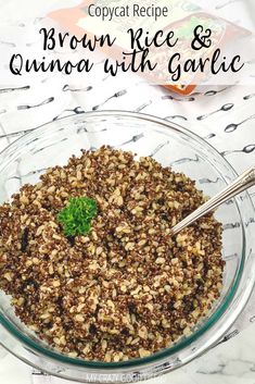 brown rice and quinoa with garlic in a glass bowl on a marble table