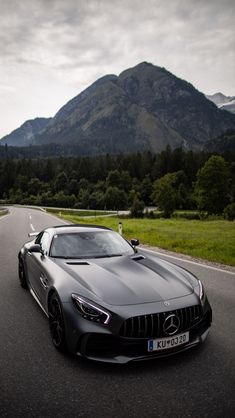 a mercedes sports car driving down the road