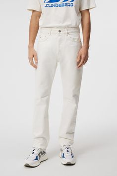 The Cody Solid Regular Jeans is our regular-fit denim pant in soft, rigid ecru denim, providing exceptional comfort and style - expertly over-dyed to achieve the perfect off-white shade, exuding timeless elegance. It features classic details like a button fly, reinforced riveted front pockets, signature elements such a Ecru Denim, Tailoring Jeans, Polo Sweater, Suit Accessories, Mens Essentials, The Bridge, Denim Pant, Sweater And Shorts, Denim Fabric