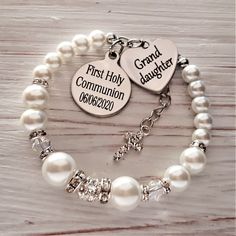 This pretty white pearl bracelet would make a stunning gift and keepsake for your Granddaughter on her First Holy Communion. The bracelet is made using 10, 8 & 6mm white pearls along with Swarovski Ab bicone beads that shimmer in the light and a sparkling rhinestone crystal bead. The charms are stainless steel , please leave the engraving details you require ie.. Date of Communion in the box on the listing. Please choose the size you require from the drop down box to order. Your bracelet wil Adjustable Pearl Bracelet For First Communion, Personalized Silver Pearl Bracelet For Birthday, Adjustable Pearl Bracelet With Charm For First Communion, Adjustable Pearl Charm Bracelet For First Communion, Personalized Adjustable Pearl Bracelet, White Hypoallergenic Pearl Bracelet For First Communion, Hypoallergenic White Pearl Bracelet For First Communion, Adjustable Rosary Bracelet For First Communion And Mother's Day, Personalized White Pearl Bracelet For Baptism