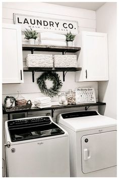 a white washer and dryer sitting next to each other in a laundry room