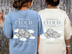 two children wearing matching tshirts with the words cloud nine on them in front of a tin foil backdrop