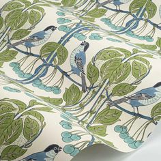 a blue and green wallpaper with birds on it