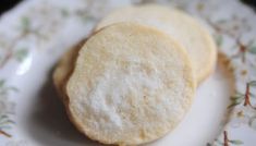 two cookies on a plate with floral designs