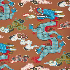 a blue and red dragon on brown background with white clouds in the sky above it