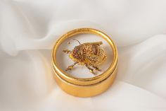 "Gold bee brooch it is embroidered brooch 24k Yellow Gold bead and gimp. Gold insect brooch has size - 1*0.6 inches (2,5*1,5cm). Luxurious, exquisite and feminine designer's jewelry - gold bumblebee brooch. The honey bee brooch will perfectly complement your unique jewelry collection or will be a wonderful gift to a very special person. A bee brooch's body tightly and neatly hand-embroidered on felt using Czech crystals, Toho seed beads, and sequins, Golden gimp, and chenille. Gold bee brooch wi Gold Embroidered Brooches For Gifts, Embroidered Gold Brooches As Gifts, Gold Embroidered Brooch For Gift, Insect Brooch, Feminine Jewelry, Embroidered Brooch, Bee Pin, Bee Brooch, Insect Jewelry