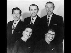 an old black and white photo of men and women in business attire smiling for the camera