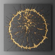 an abstract painting with gold paint on a black background, in the shape of a circle