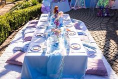 a long table set up for a party