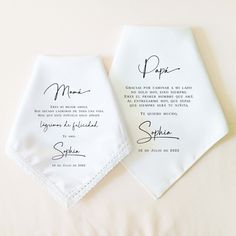 two personalized wedding handkerchiefs on top of each other