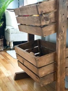 a wooden crate sitting on top of a hard wood floor