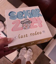 someone holding up a sign that says sexor 24 last rodeo