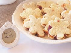 some cookies are in a white bowl on a table