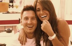 a man and woman are smiling for the camera while they pose for a photo together