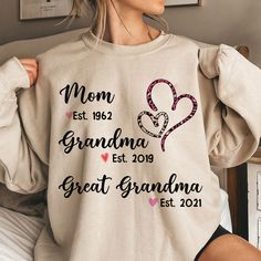 "Personalized Mom Grandma Great-Grandma Sweatshirt,Custom Grandkid names Grandma and Year Shirt,Gift For Great-Grandma Mom Step Mom  Please Check All Photos for Details  * Due to monitor differences, actual colors may vary slightly from what appears online How To Order 1-) Please, Check and Review all Photos. 2-) Select Your T-Shirt Size and T-Shirt Color from drop down menus. 3-) Choose Your Quantity as much as you want. 4-) Click ADD TO CART. And, you can go back to add more product color for your family members or You can complete the checkout process. 5-)Please Click \"Proceed to Check Out\" SIZING - The Unisex sizing makes the shirt run larger than your average t-shirt (for women). We suggest ordering a size smaller than what you would normally wear. The shirts run true to size for me Heart Leopard, Grandma Sweatshirt, Great Grandma Gifts, Great Grandma, Personalized Grandma, Grandma Shirts, Mom And Grandma, Grandparents Day, Personalized Embroidered