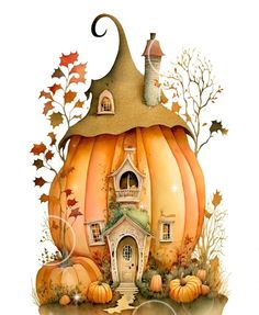 a pumpkin shaped house sitting on top of a pile of leaves