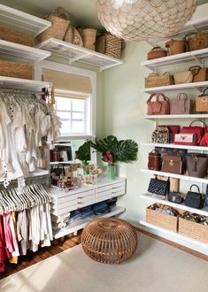 the closet is full of purses, handbags and other items in baskets on shelves