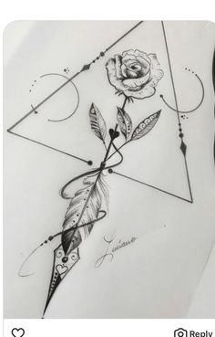 a rose and some feathers on top of a piece of paper with an arrow in the middle