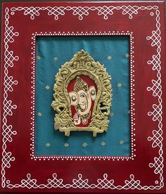 an intricately decorated frame with a painting on it